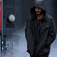 Jared Leto wears a hooded jacket in a street scene from Morbius.